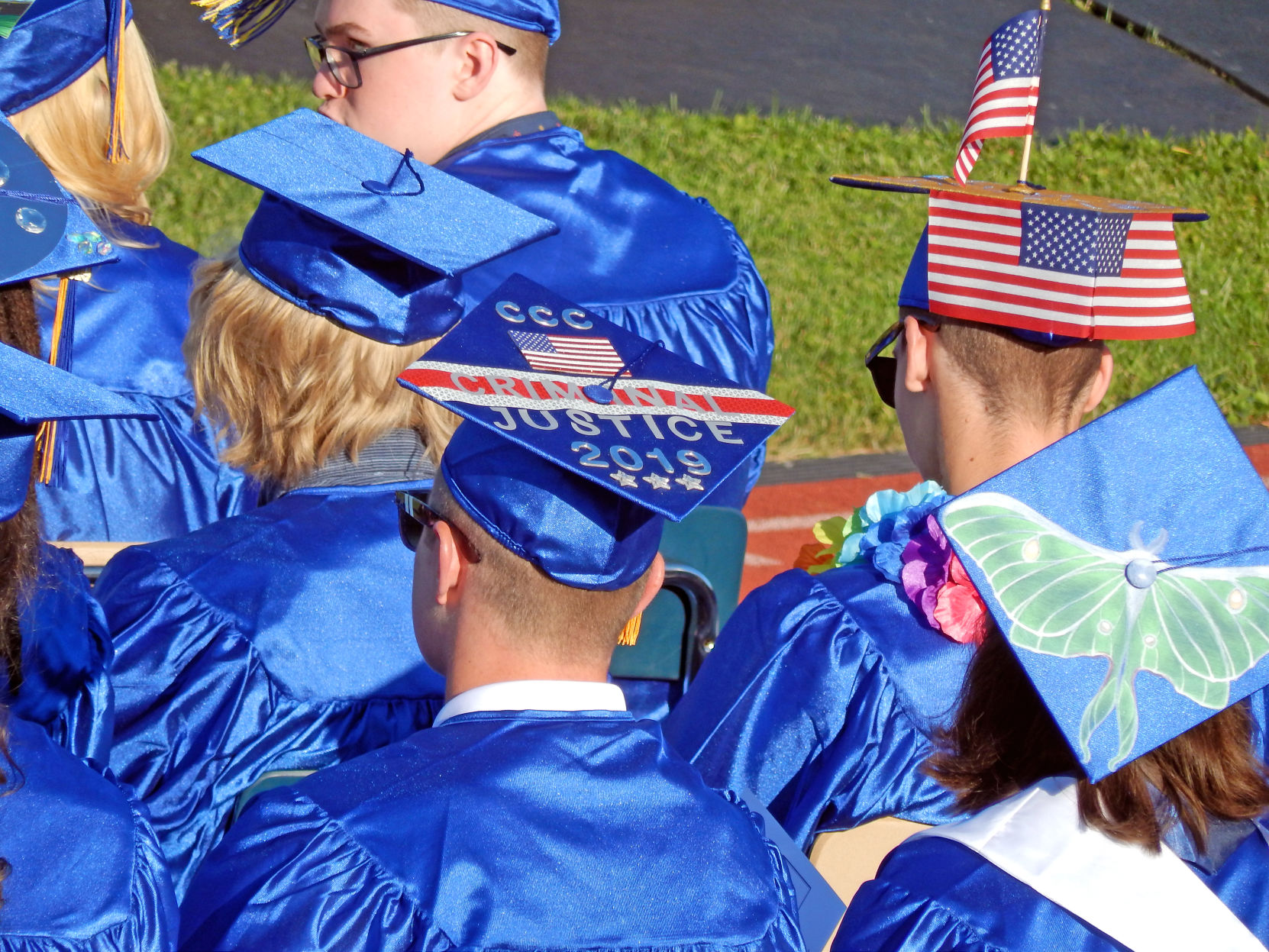 Members of the Class of 2019 sport decorated caps.